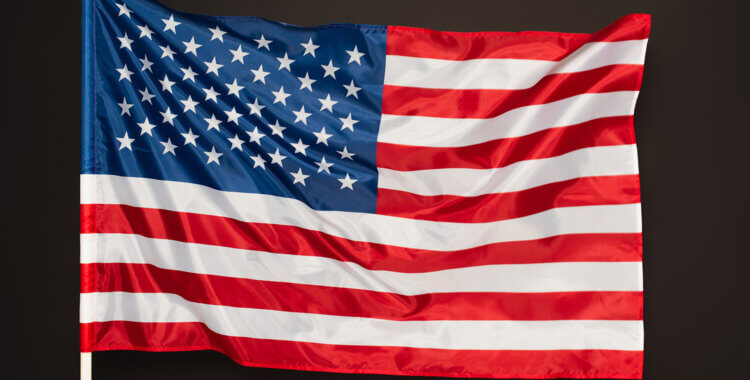 read and blue flag of america with stars and stripes isolated on black
