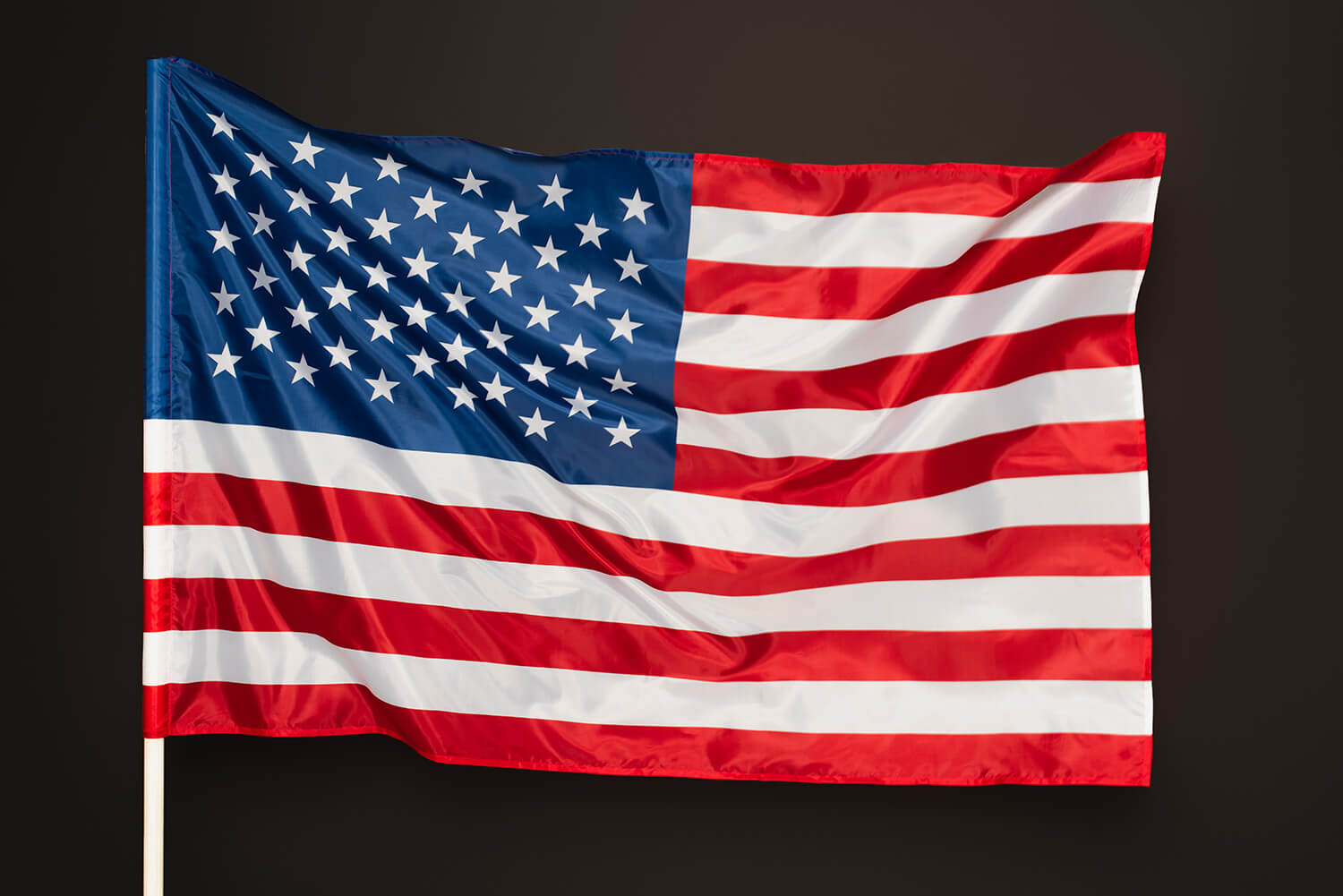 read and blue flag of america with stars and stripes isolated on black