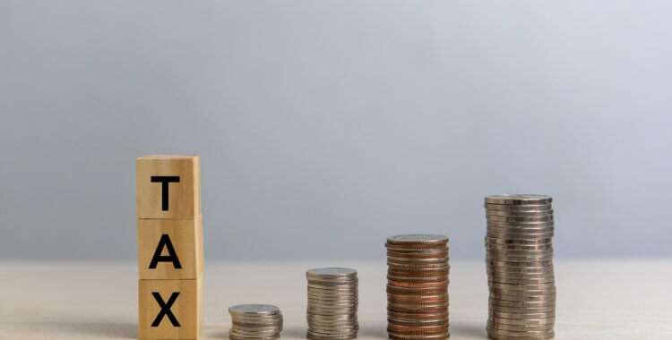 tax cube and money on desk