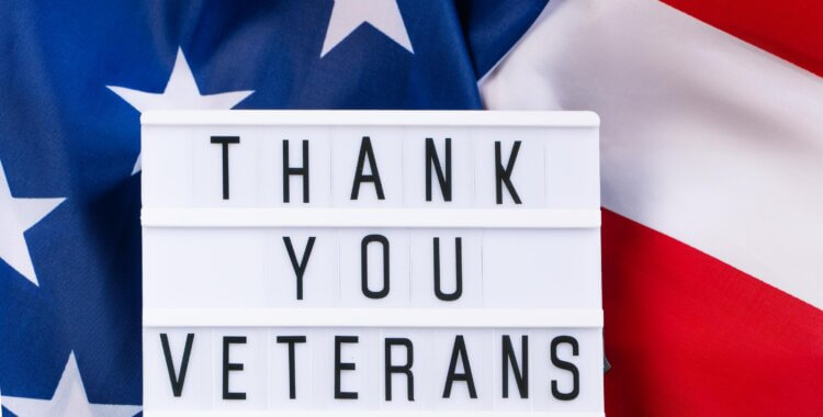 American flag and inscription Thank you veterans on a white background.